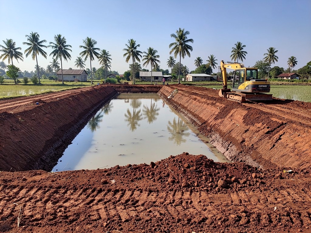 Newly excavated earthen shrimp pond under construction